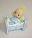 Baby in bedje wolhaar